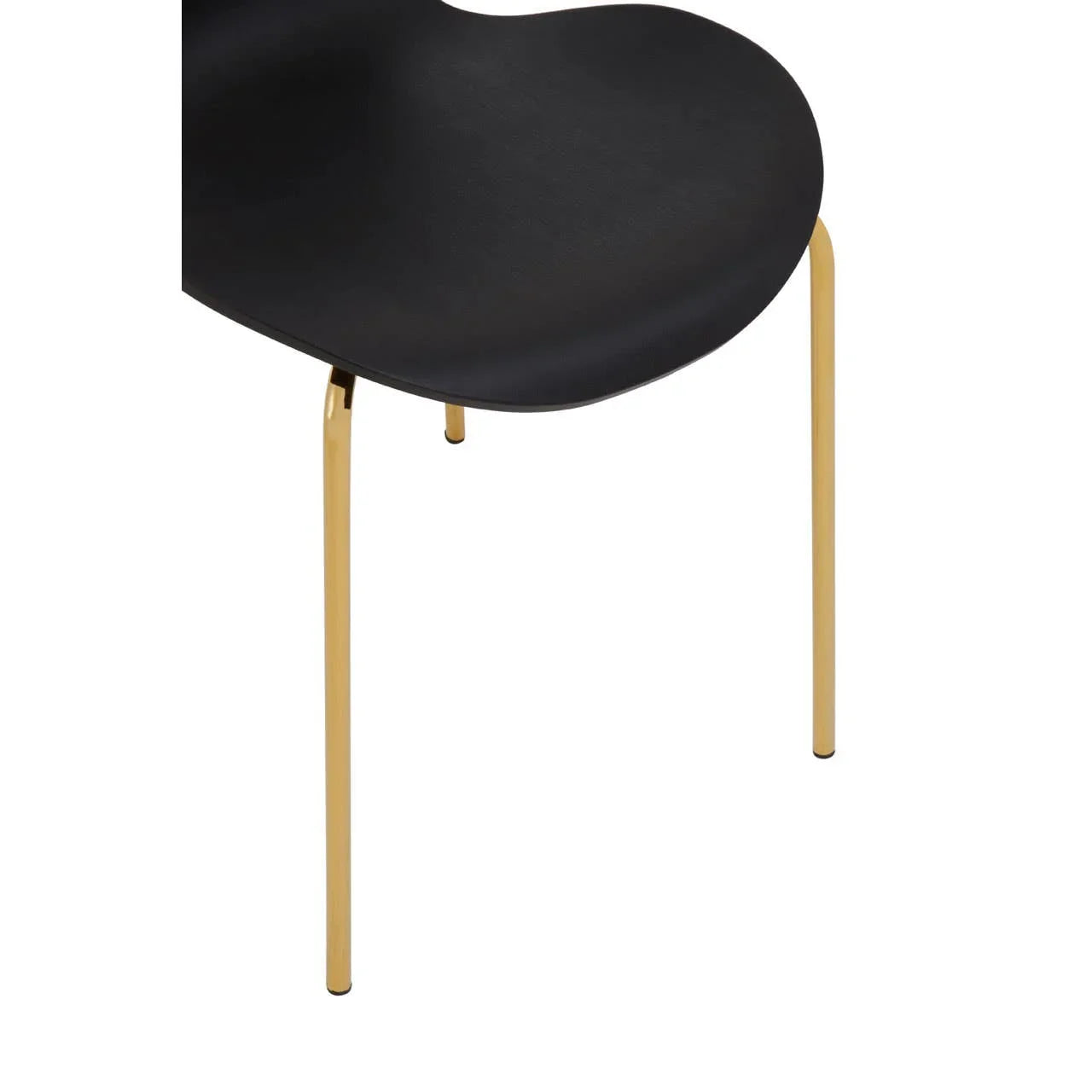 Black dining chair with curved seat and slim gold metal legs, close-up view
