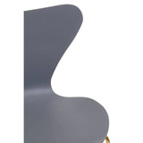 Blue dining chair with curved backrest and smooth finish, partial side angle