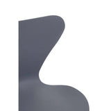 Closeup of curved grey dining chair backrest with smooth matte finish