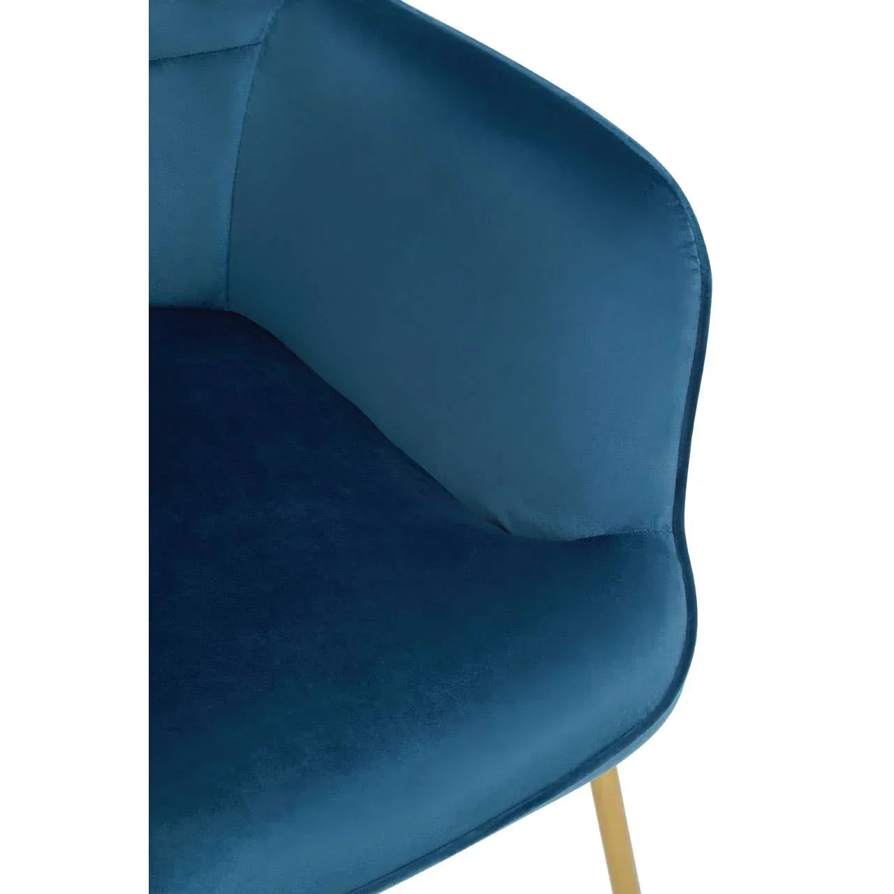 Blue velvet dining chair with curved backrest and gold metal leg close-up