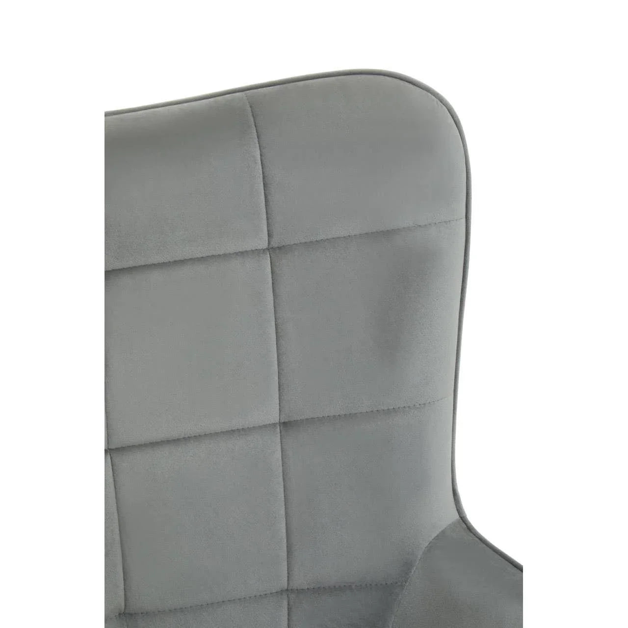Close up of grey upholstered chair back with square stitched pattern