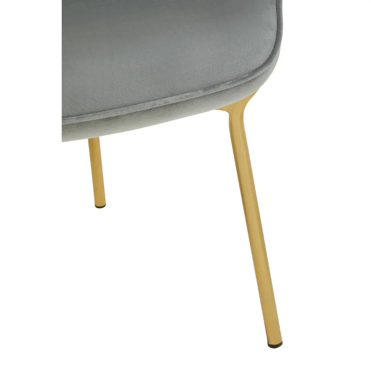 Grey velvet dining chair seat with gold metal leg close-up