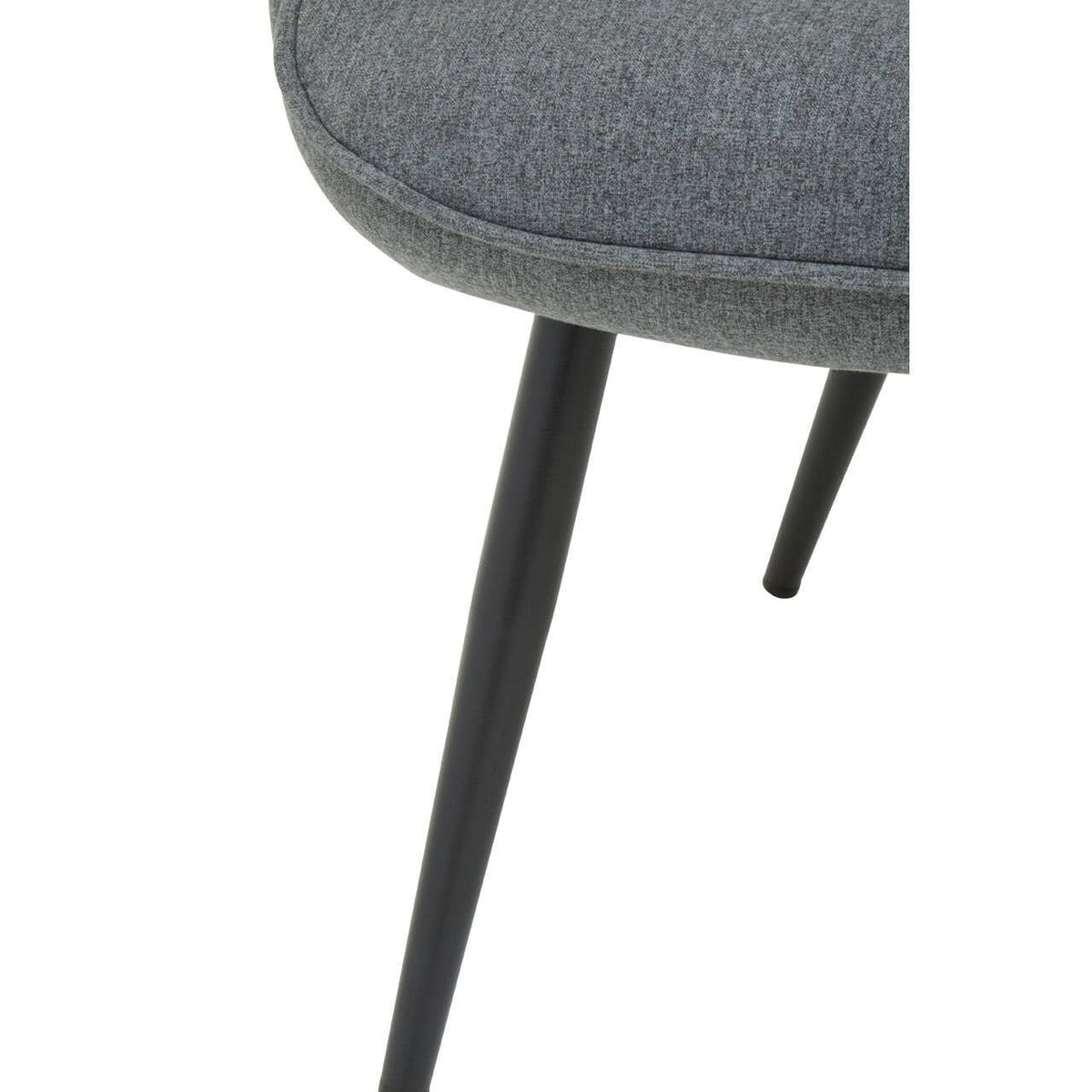Close up of grey fabric dining chair seat with black tapered metal legs