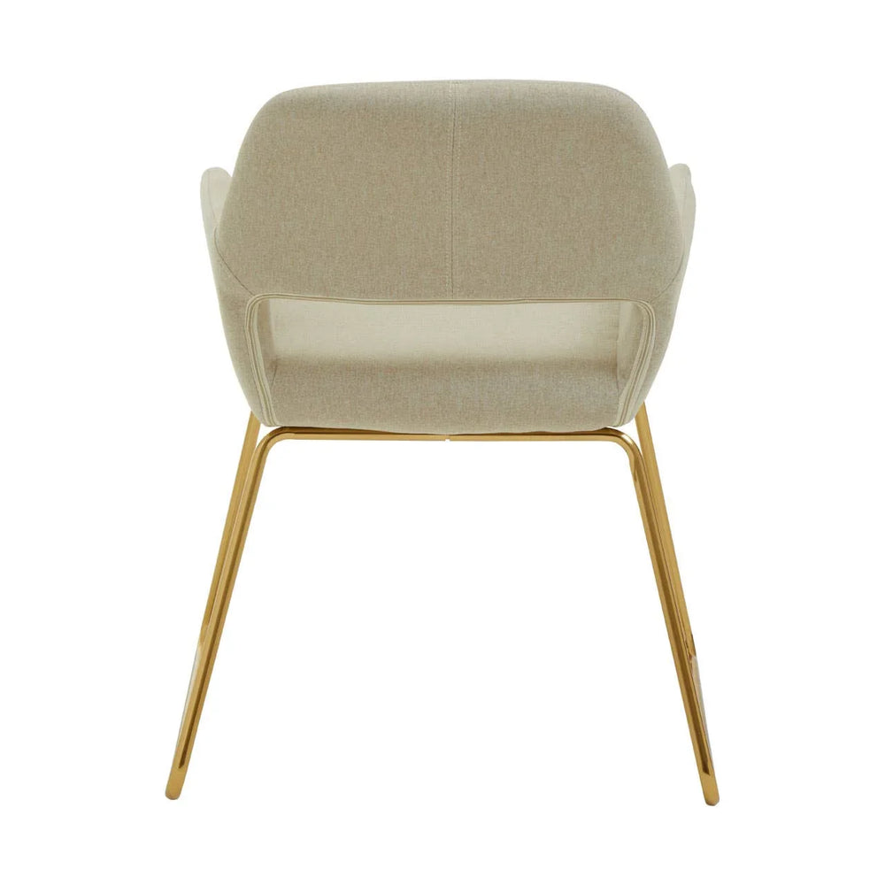 Beige fabric dining chair with gold metal legs, rear view