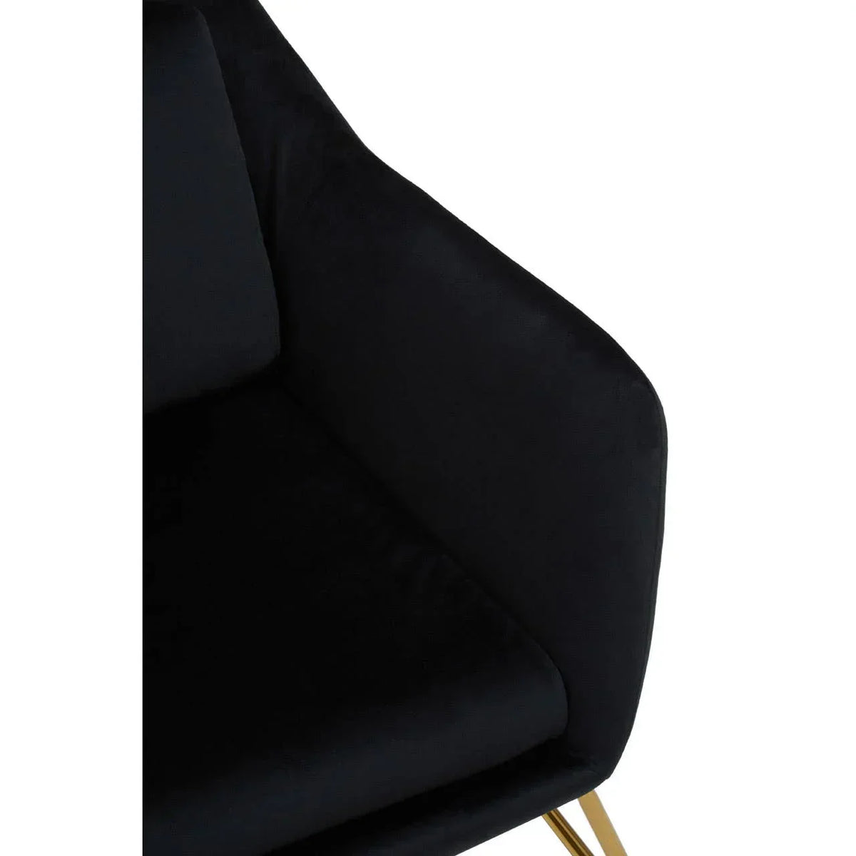 Black velvet armchair with gold legs, close view of seat and armrest