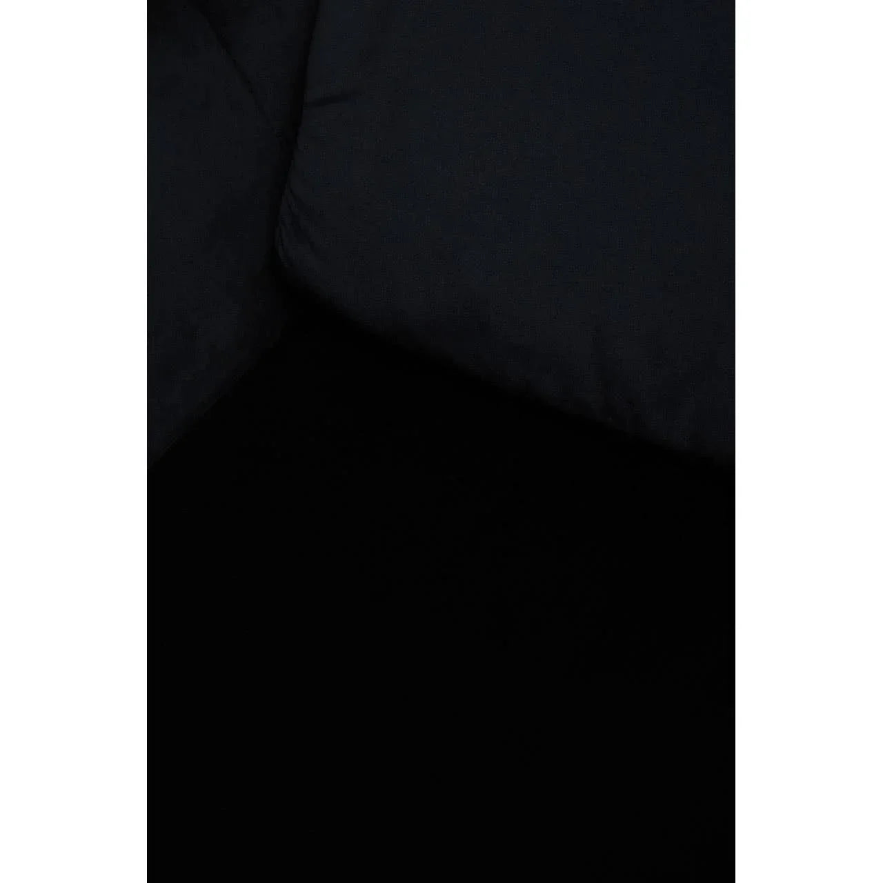 Close up of black fabric sofa cushion corner and seat surface