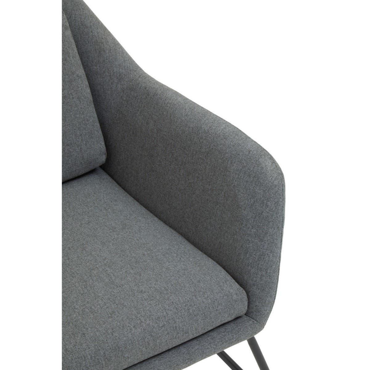 Grey fabric armchair detail with padded seat and slim black legs