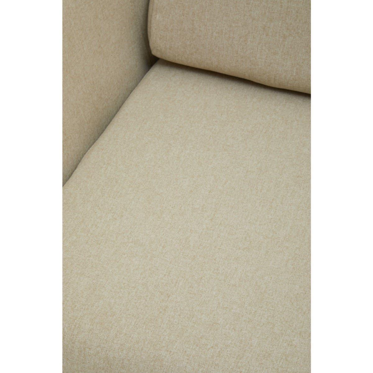 Beige fabric sofa seat with cushion and armrest close-up