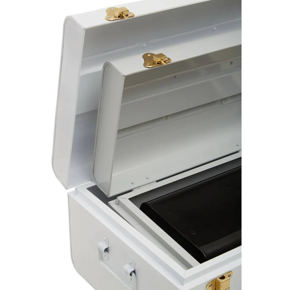 White metal storage trunk with open lid and gold latches, showing interior compartments