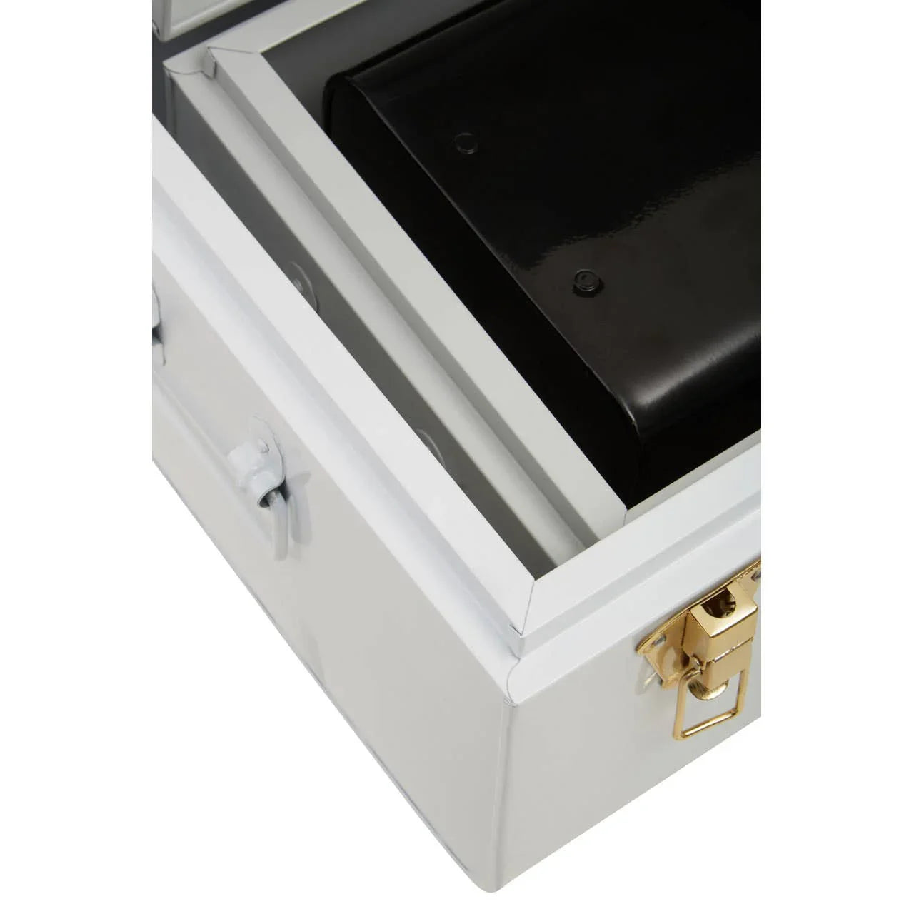 Closeup of white metal storage trunk with gold latch and black interior compartment