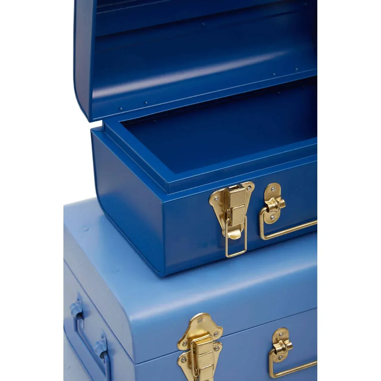 Stacked blue metal storage trunks with gold latches and handles, top trunk open