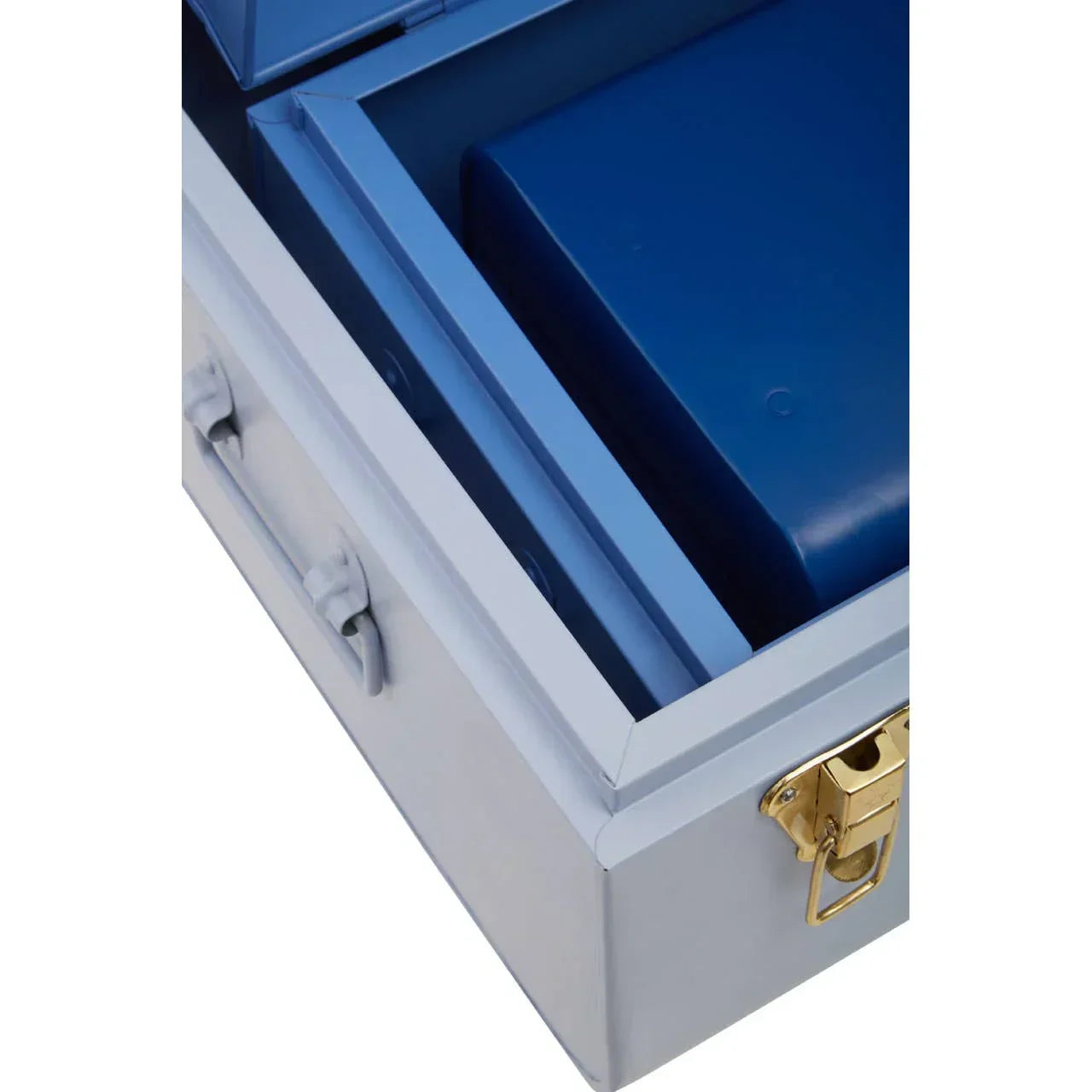 Closeup of light blue storage trunk with gold latch and blue interior compartment
