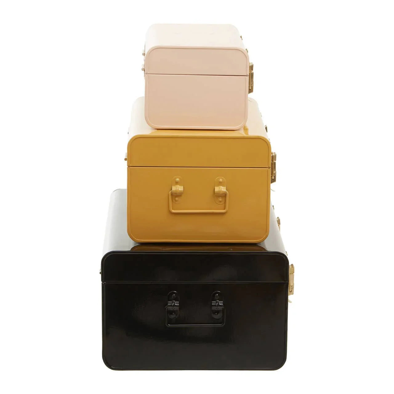 Set of three metal storage trunks in cream, mustard, and black stacked on white background