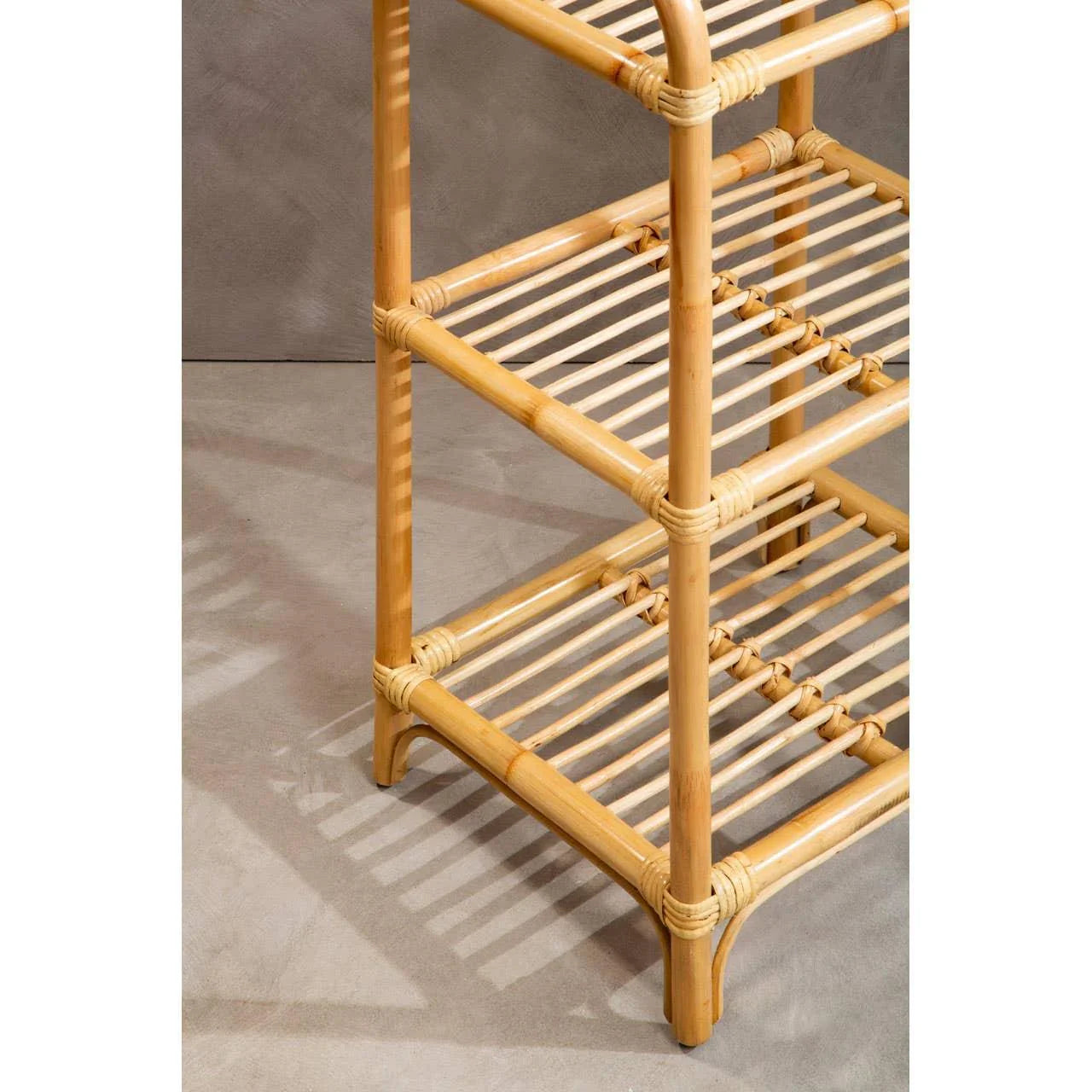 Natural bamboo shelving unit with three slatted shelves and rounded edges, close view