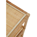 Three-tier shelf unit made of natural rattan, featuring a light wood frame and woven rattan surfaces. The top shelf is partially visible, showcasing the textured weave and clean lines of the design. The unit has a sturdy construction with a minimalist aesthetic, ideal for home decor