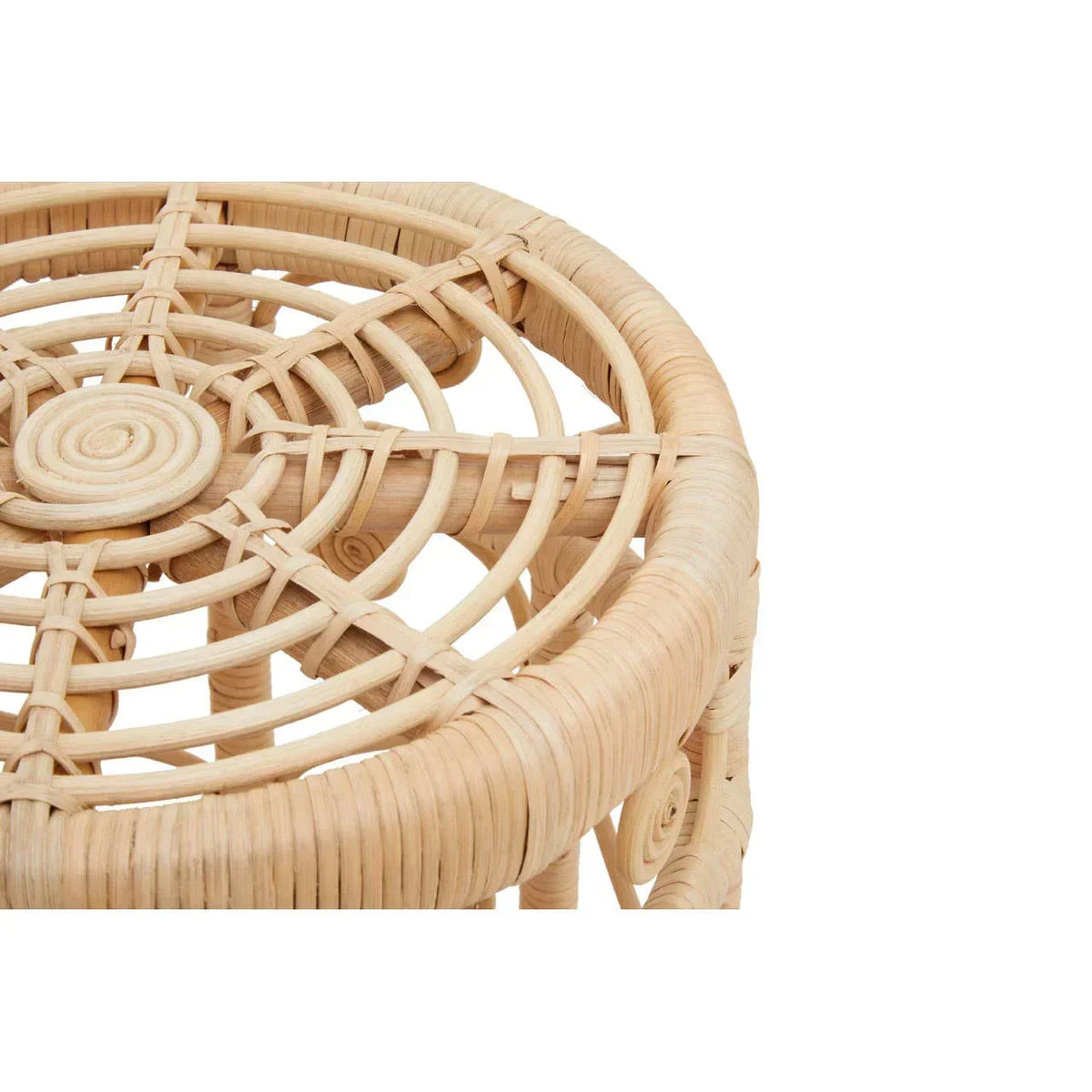 Closeup of round rattan stool top showing woven natural cane pattern