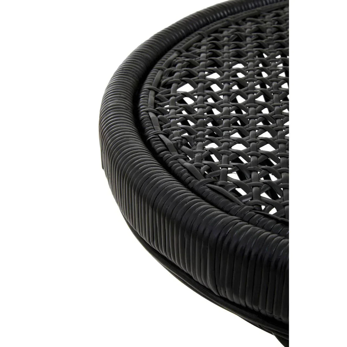 Closeup of black rattan garden table edge and woven tabletop detail