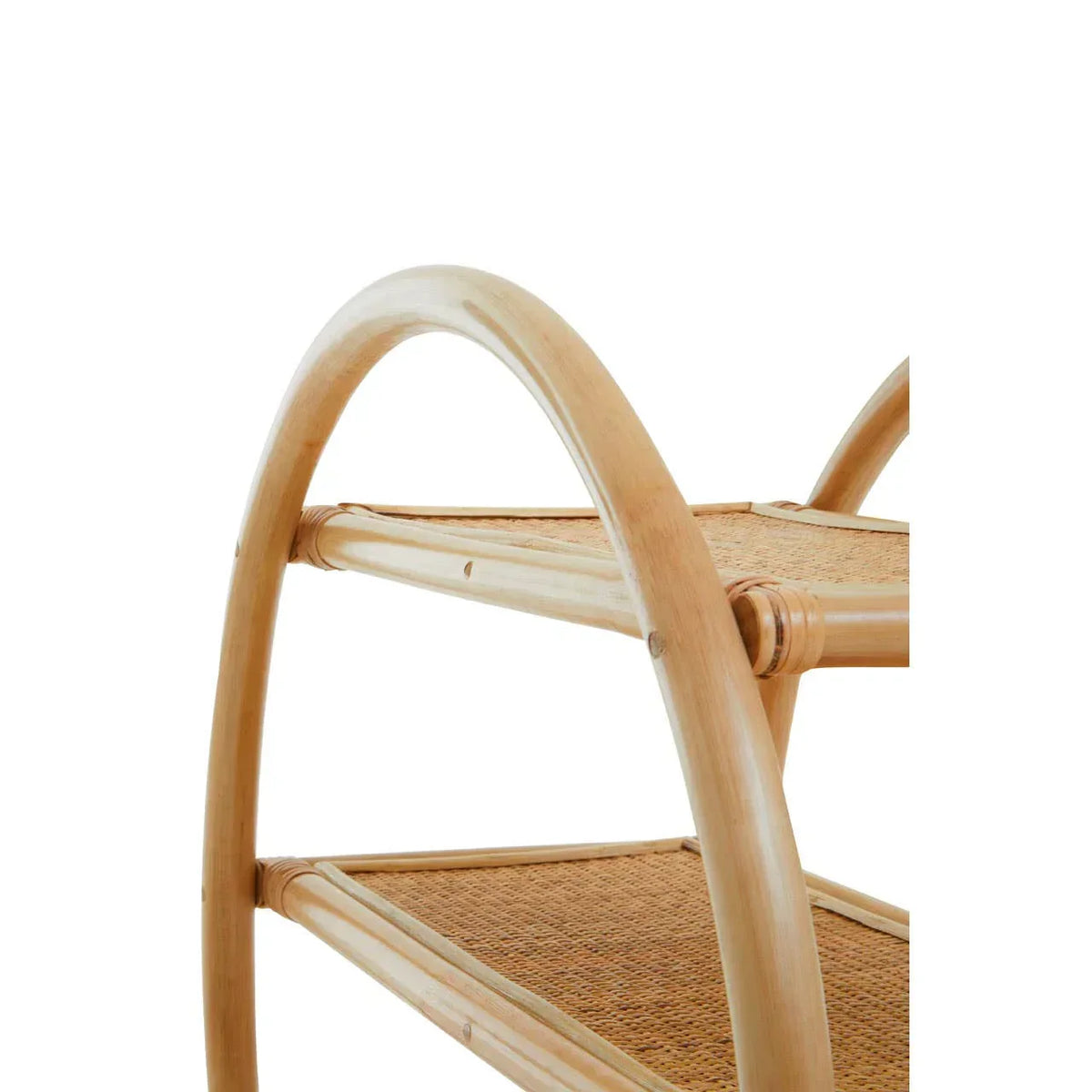 Closeup of rattan side table with natural wood frame and woven shelves