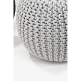 Round grey knit pouffe with a textured pattern, resting on a light surface. The pouffe features a soft, cozy appearance, suitable for children's rooms or play areas