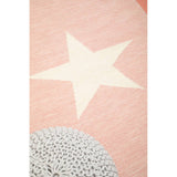 A soft grey knit pouffe designed for kids, featuring a textured surface and a cozy appearance, placed on a light pink rug with a large cream star and a circular grey pattern