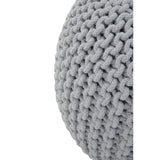 A close-up view of a round grey knit pouffe, showcasing its textured, woven pattern and soft fabric. The pouffe has a smooth, rounded shape and is designed for comfort and style in a children's room