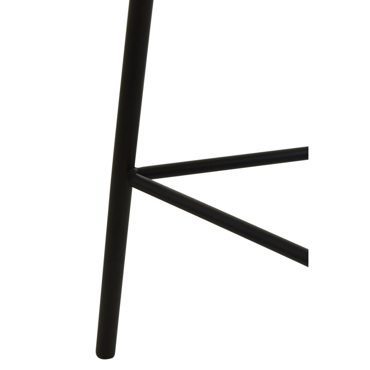 Close-up view of the black metal legs of the Depok Rattan Seat Stool, showcasing a minimalist design with a triangular support structure. The legs are sleek and modern, emphasizing stability and style