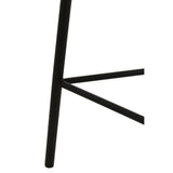 Close-up view of the black metal legs of the Depok Rattan Seat Stool, showcasing a minimalist design with a triangular support structure. The legs are sleek and modern, emphasizing stability and style