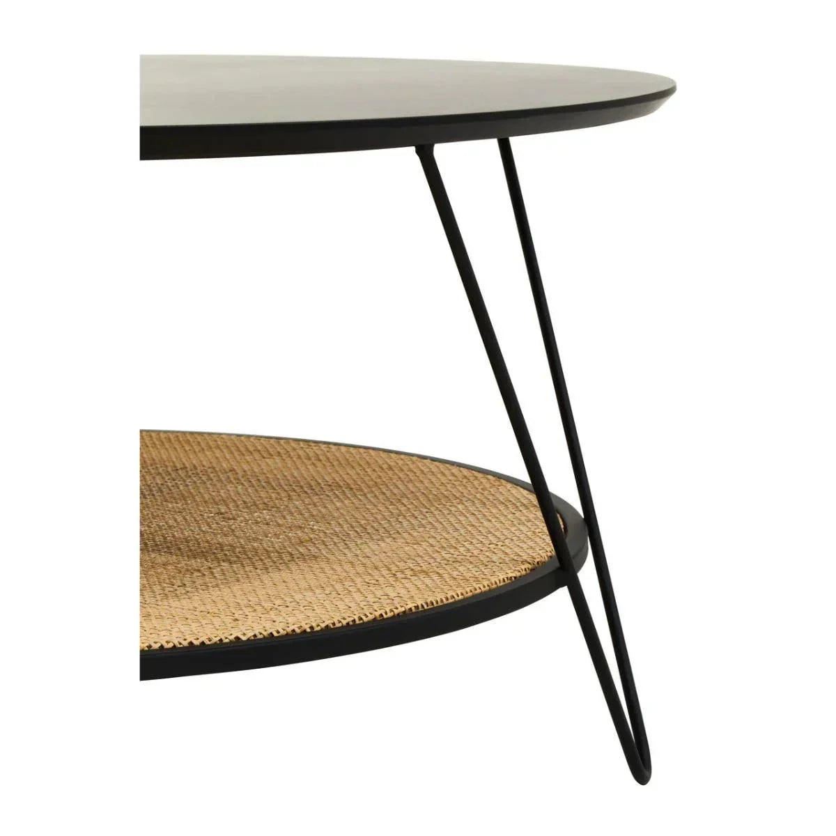 Round coffee table with black metal frame and woven rattan shelf, side angle view