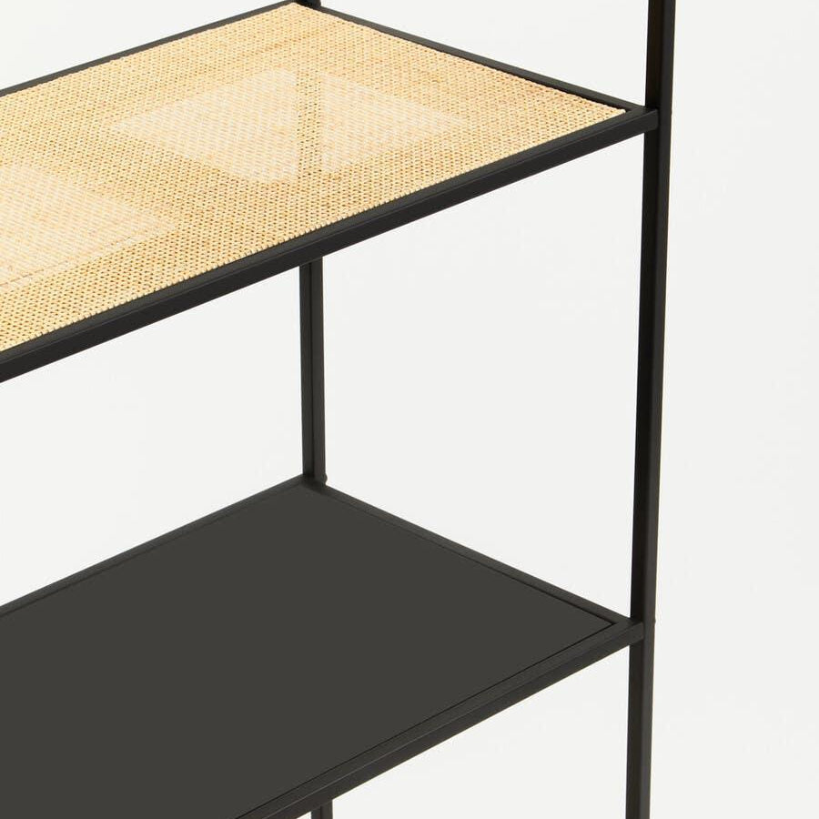 Black metal shelving unit with rattan and solid black shelves, close-up view