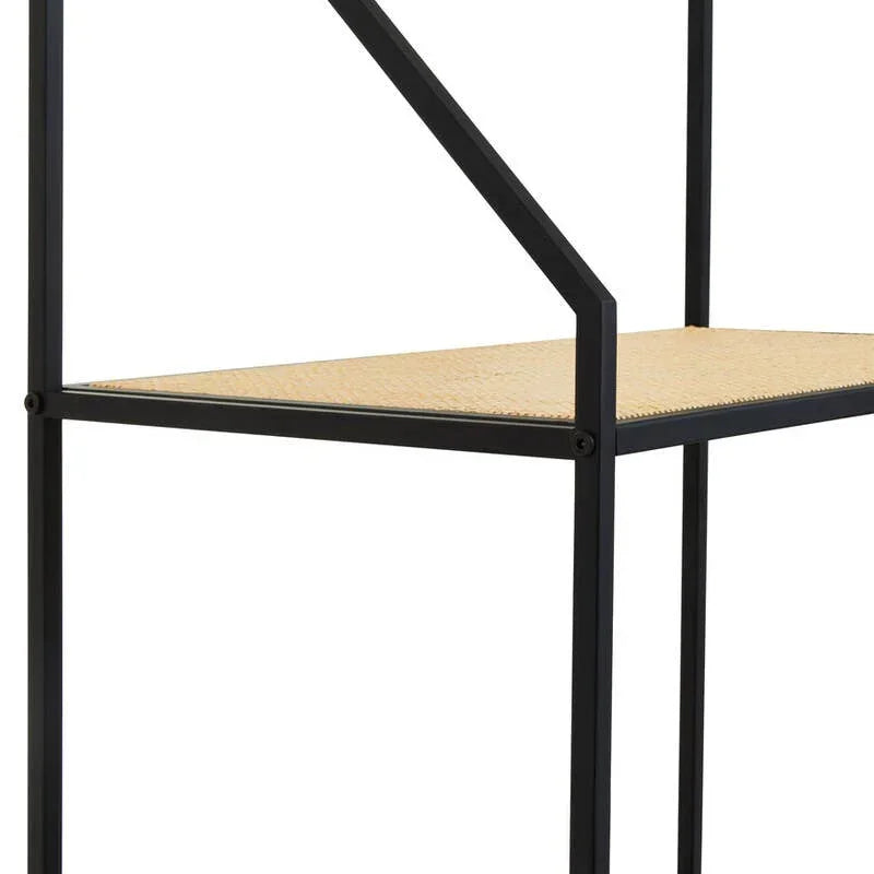 Black metal shelving unit with rattan middle shelf and minimalist frame, side angle view