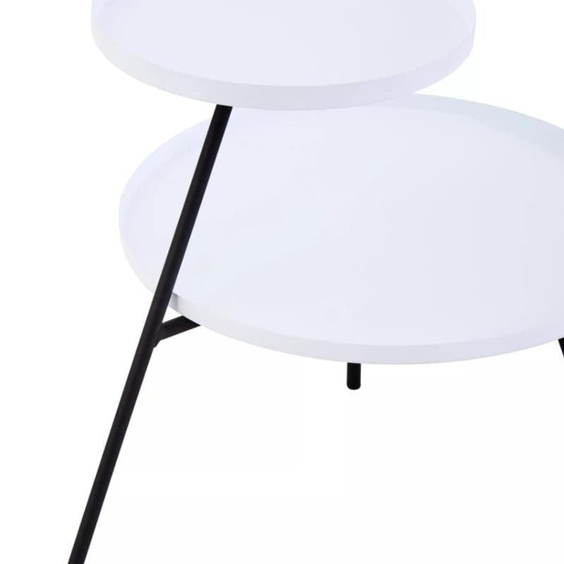A modern side table featuring two circular white tabletops supported by a sleek black metal frame with a single angled leg. The design is minimalist and contemporary, suitable for various home decor styles