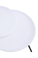 A modern side table featuring two circular white tabletops of varying sizes, supported by a sleek black leg. The design is minimalist and contemporary, suitable for various home decor styles
