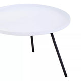 Round white tabletop with a smooth finish supported by two slender black legs, creating a modern and minimalist side table design