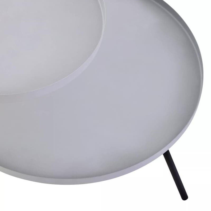 A modern side table featuring two circular shelves, one in a light grey finish and the other in a contrasting black. The table has slender black legs that provide stability and a sleek look, suitable for contemporary home decor