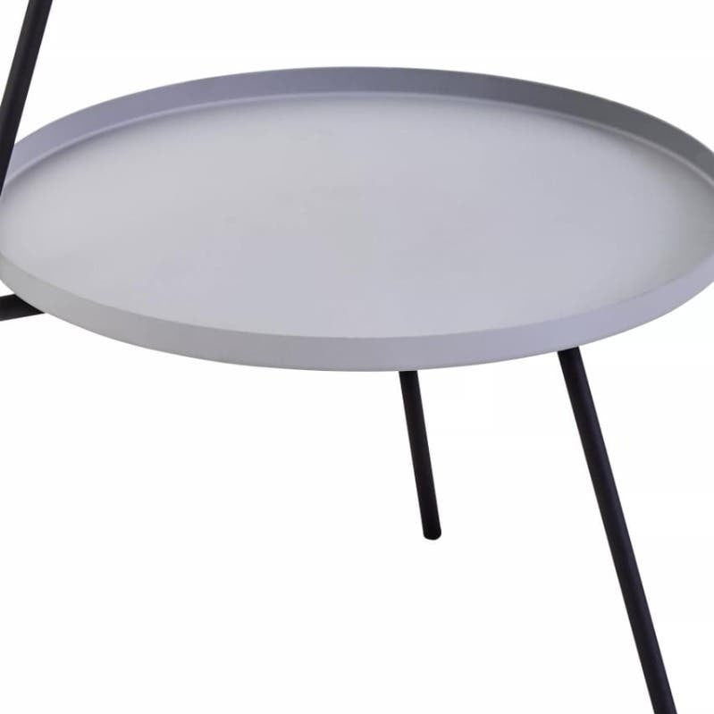 A modern two-shelf side table featuring a round grey top and a black metal frame with slender legs, designed for contemporary home decor