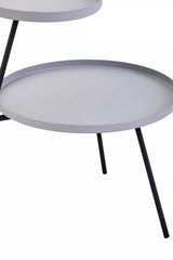 A modern two-shelf side table featuring a round grey top and a black metal frame with slender legs, designed for contemporary home decor