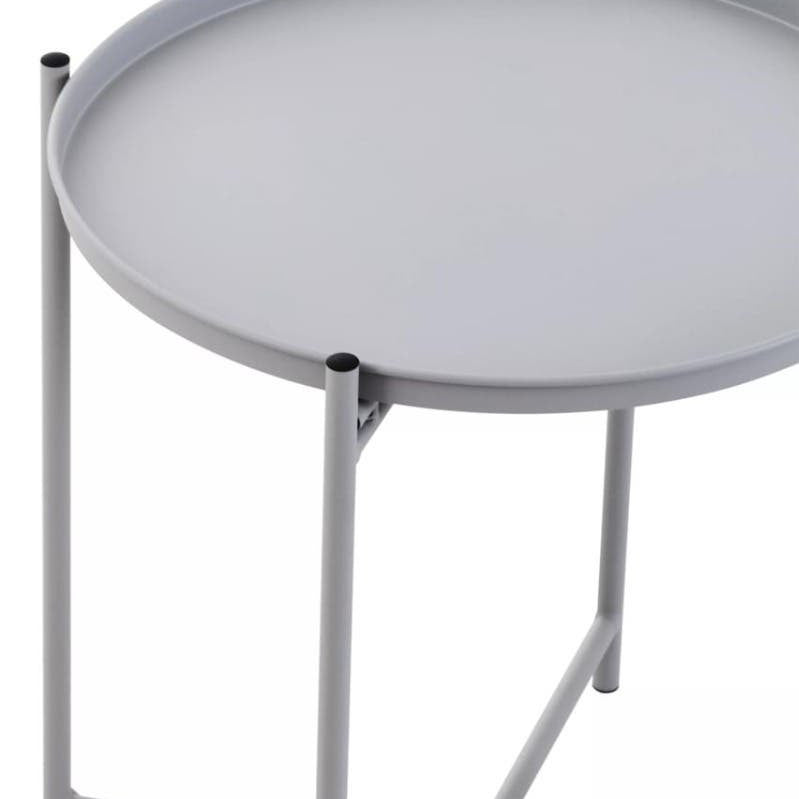 Round grey iron side table with a smooth surface and slender legs, featuring a minimalist design that complements modern decor