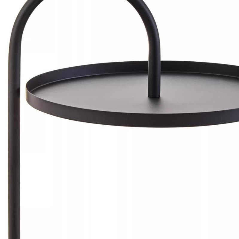 Black hanging side table featuring a circular top with a central support and a curved handle-like design. The table has a minimalist aesthetic with a sleek, modern finish
