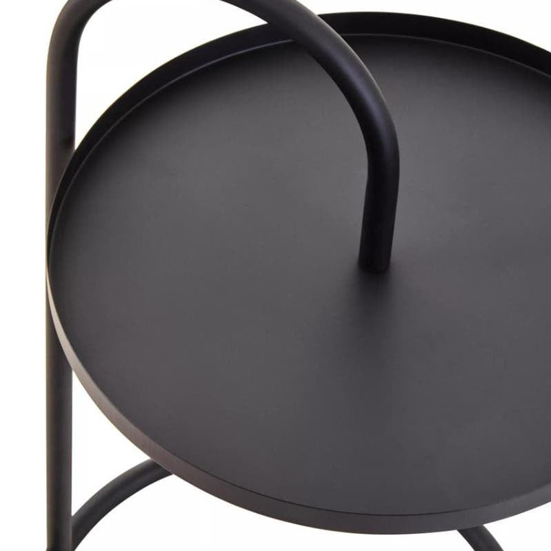 Round black top side table with a minimalist design, featuring a curved handle and a sturdy base. The surface is smooth and matte, while the legs are sleek and circular, providing a modern aesthetic suitable for various home decor styles