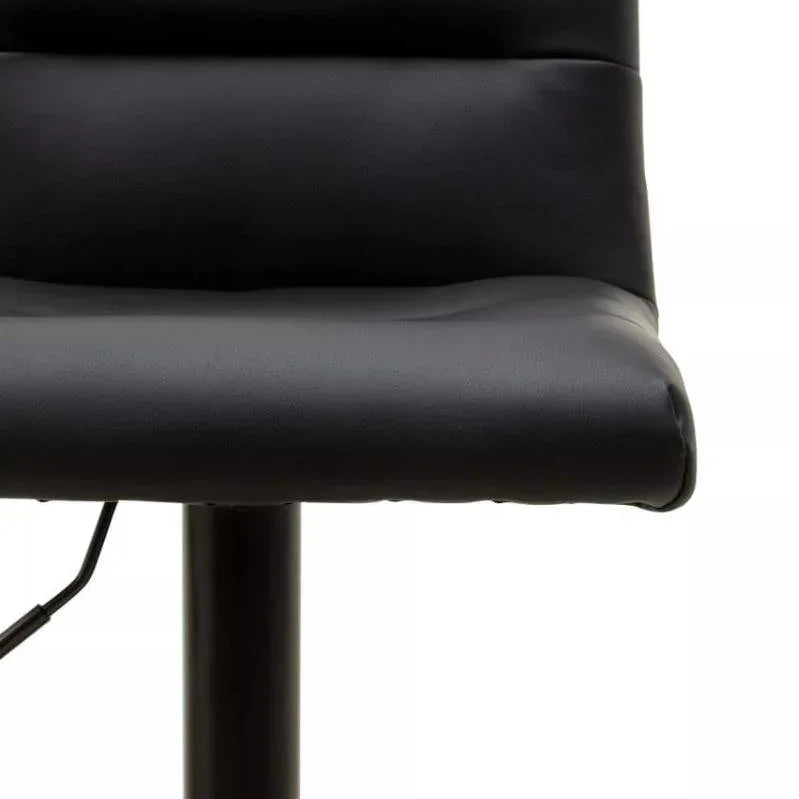 Close-up of black faux leather bar stool with padded seat and backrest