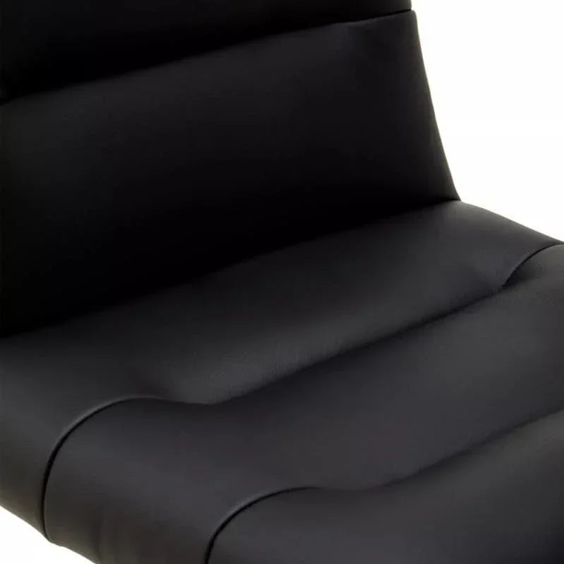 Close-up of black leather dining chair seat with padded detail and stitching