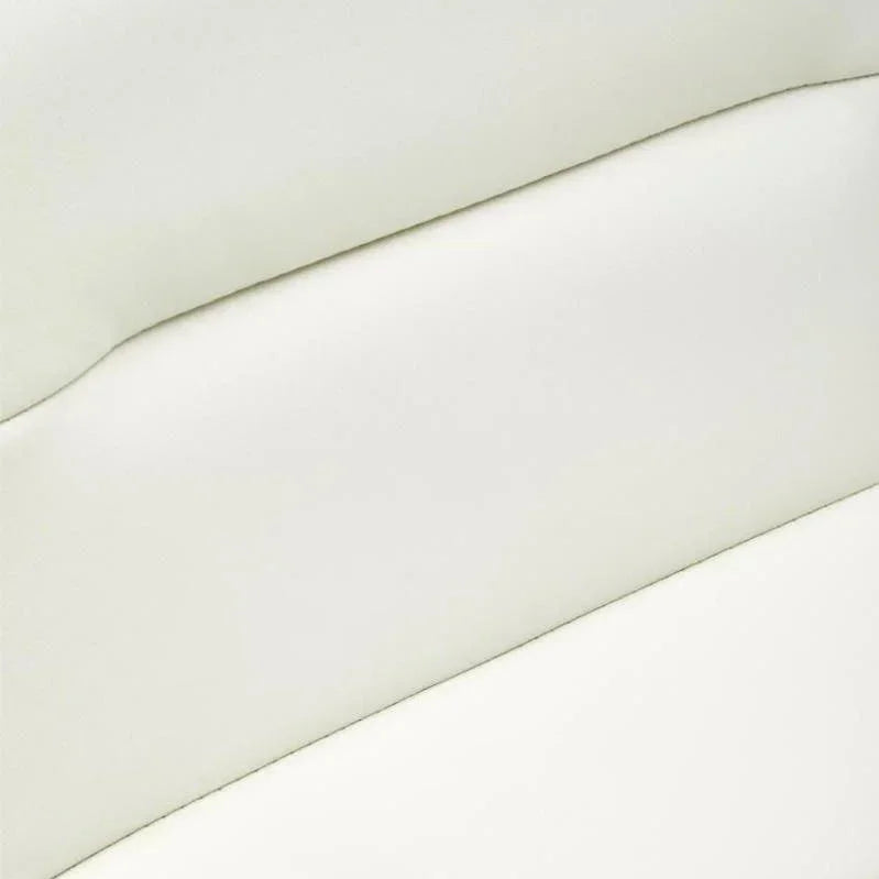Close view of cream faux leather sofa backrest with horizontal stitched detailing
