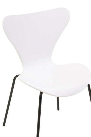 White modern dining chair with molded seat and black metal legs