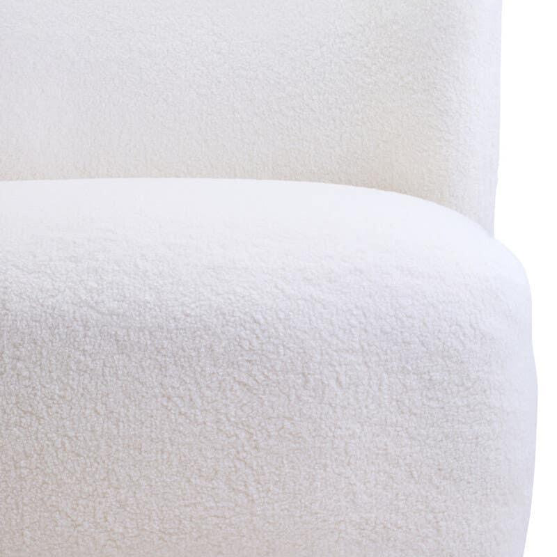White boucle sofa corner with curved backrest and textured upholstery