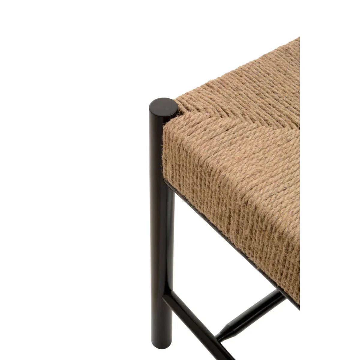 Close-up of woven rope seat on black metal dining chair corner