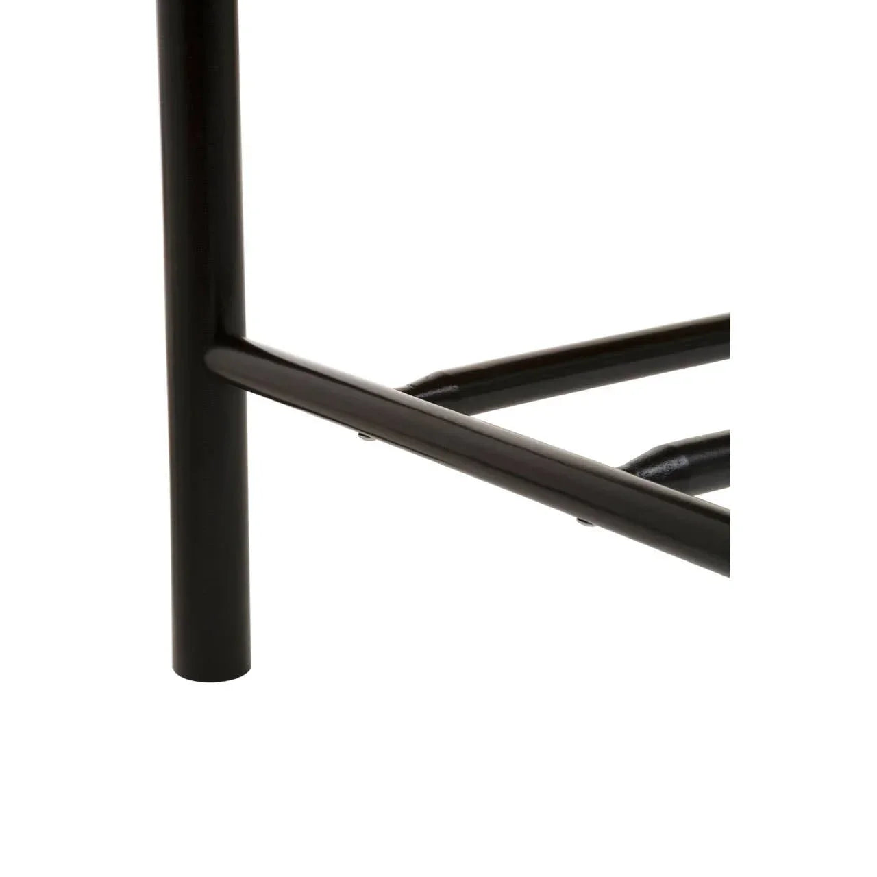 Closeup of black metal furniture leg with crossbar support