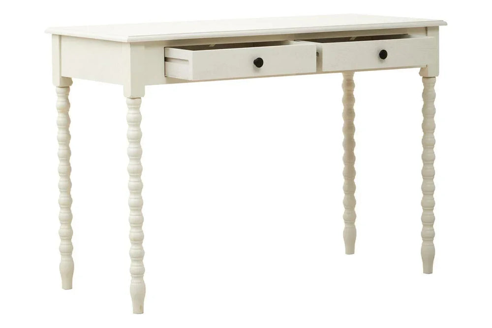 White wooden desk with turned legs and two drawers, one drawer partially open