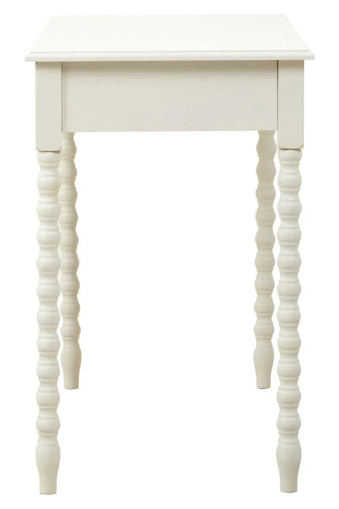 White wooden side table with carved spindle legs, front angle view