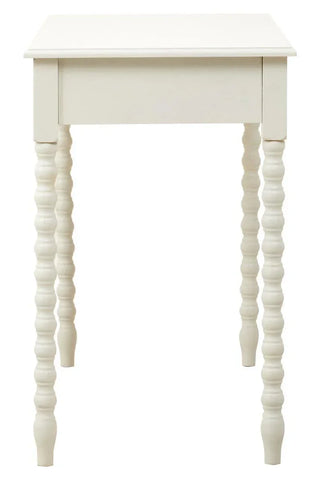 White wooden side table with carved spindle legs, front angle view