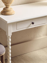 White wooden console table with single drawer and turned leg detail
